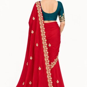 Internet Saree 
Elegance Redefined: Crimson Red Internet Saree with Contrasting Teal Blouse-
 Free Delivery 🚚
No Shipping charges